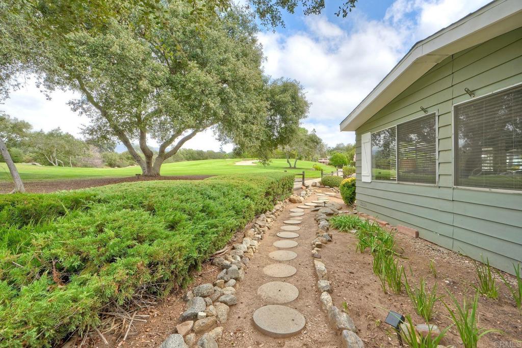 18218 Paradise Mountain Road Valley Center, CA 92082 - Photo 35 of 42 a view of a pathway of a house with a yard