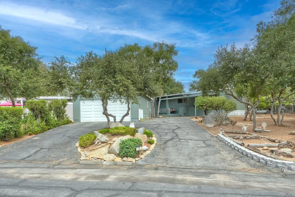 18218 Paradise Mountain Road Valley Center, CA 92082 - Photo 38 of 42 a view of a house with a yard