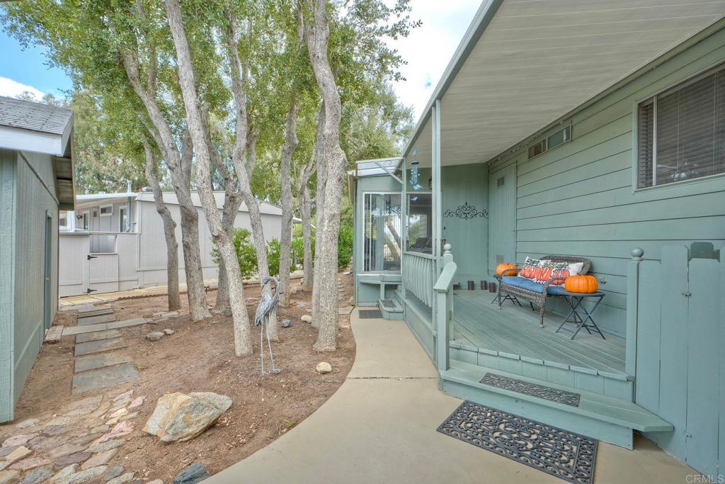 18218 Paradise Mountain Road Valley Center, CA 92082 - Photo 41 of 42 a backyard of a house with table and chairs