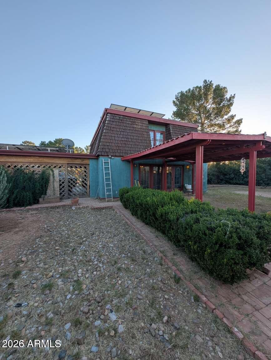 3100 11th Street Douglas, AZ 85607 - Photo 13 of 16 a front view of a house with a yard and potted plants