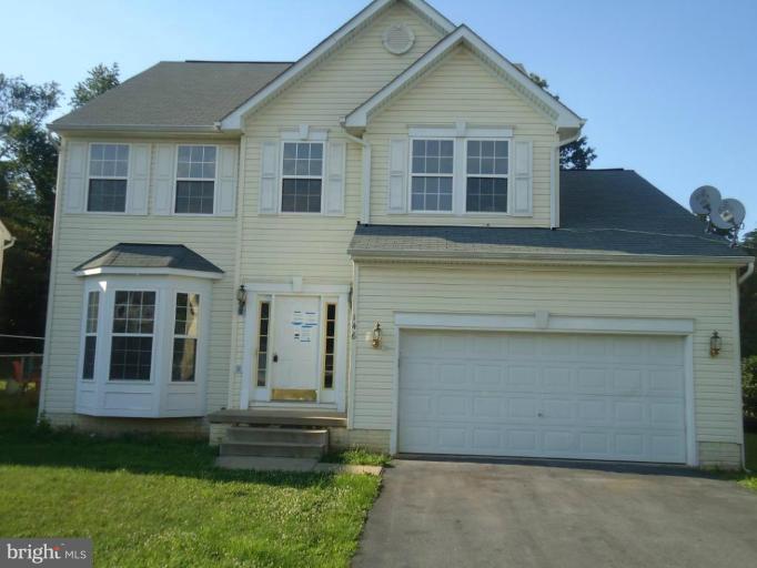 146 Ranson Estates Circle Ranson, WV 25438 - Photo 1 of 12 a front view of a house with a yard