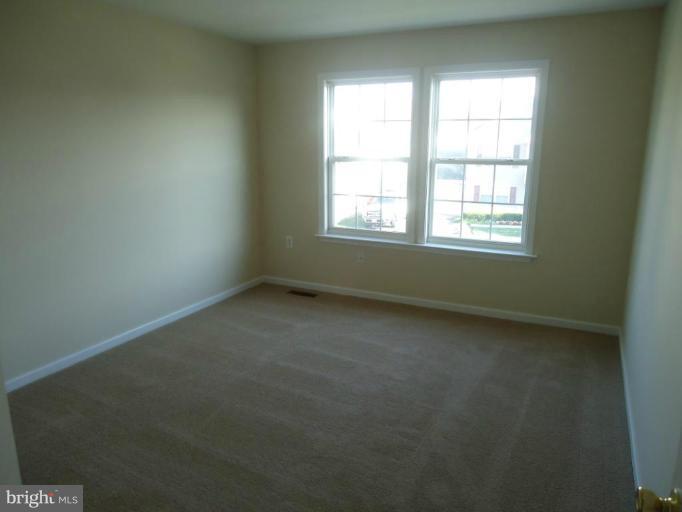 146 Ranson Estates Circle Ranson, WV 25438 - Photo 2 of 12 an empty room with a window