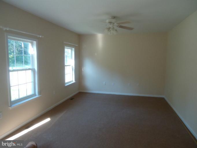 146 Ranson Estates Circle Ranson, WV 25438 - Photo 7 of 12 an empty room with windows