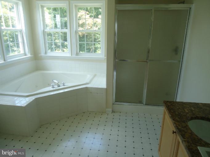 146 Ranson Estates Circle Ranson, WV 25438 - Photo 10 of 12 a bathroom with a bathtub and shower