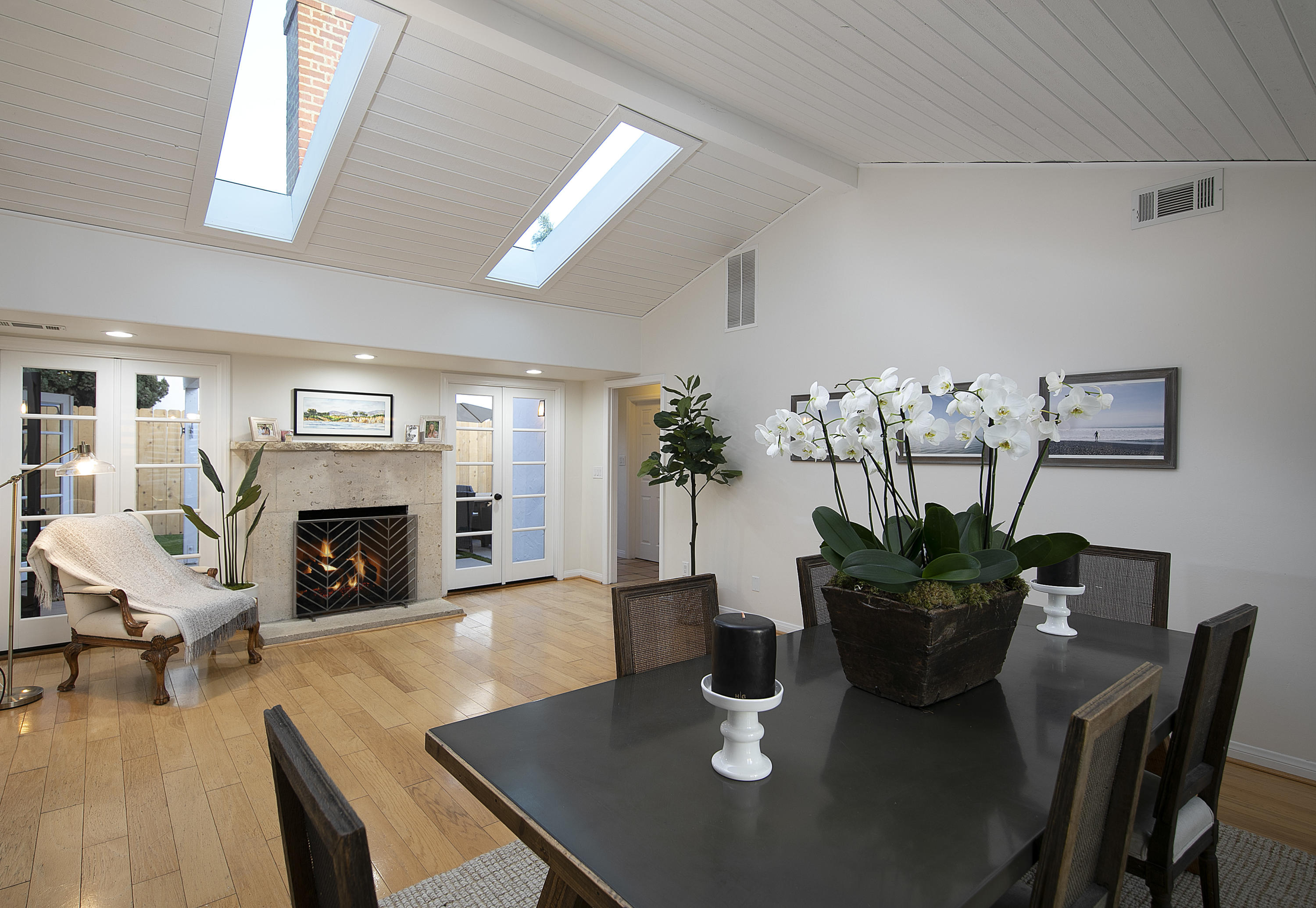 330 Mohawk Road Santa Barbara, CA 93109 - Photo 3 of 16 a view of a dining room with furniture a fireplace and wooden floor