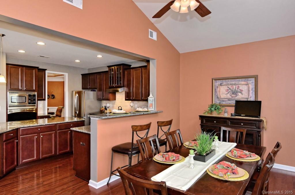 1621 Ridgehaven Road, Unit 240 Waxhaw, NC 28173 - Photo 11 of 24 a kitchen with stainless steel appliances kitchen island granite countertop a sink and cabinets