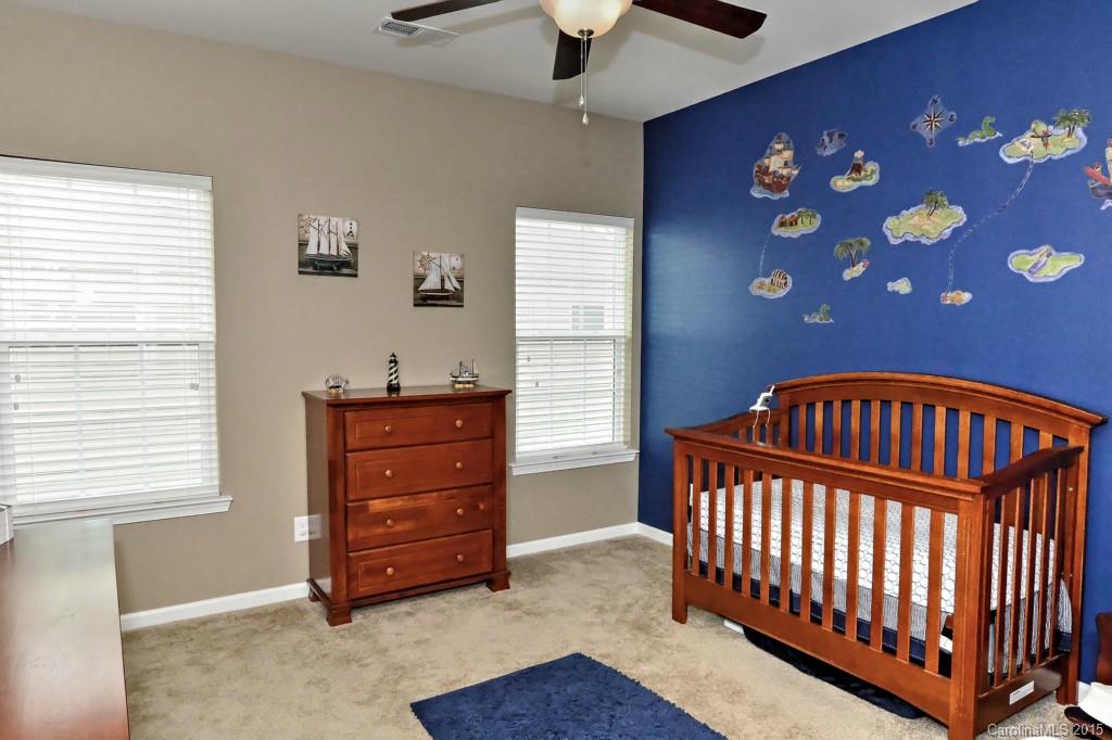 1621 Ridgehaven Road, Unit 240 Waxhaw, NC 28173 - Photo 15 of 24 a bedroom with a baby crib and a dresser
