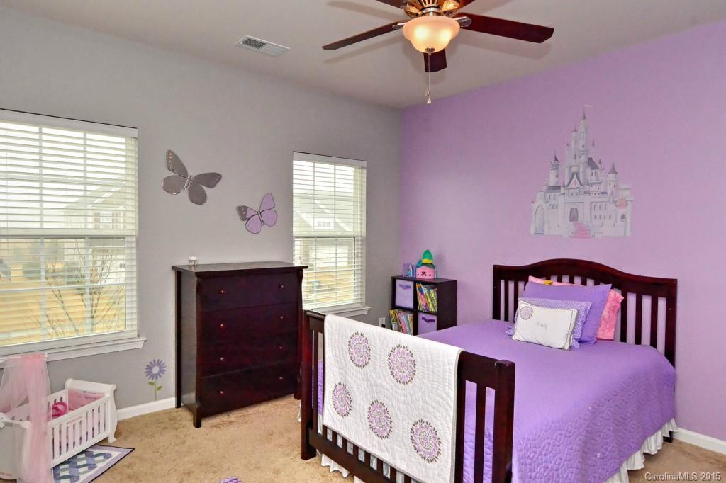 1621 Ridgehaven Road, Unit 240 Waxhaw, NC 28173 - Photo 16 of 24 a bedroom with a bed and a dresser