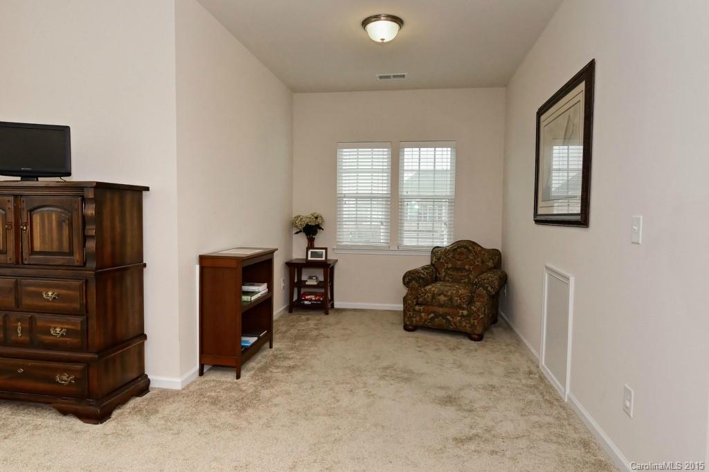 1621 Ridgehaven Road, Unit 240 Waxhaw, NC 28173 - Photo 20 of 24 a living room with furniture and a flat screen tv