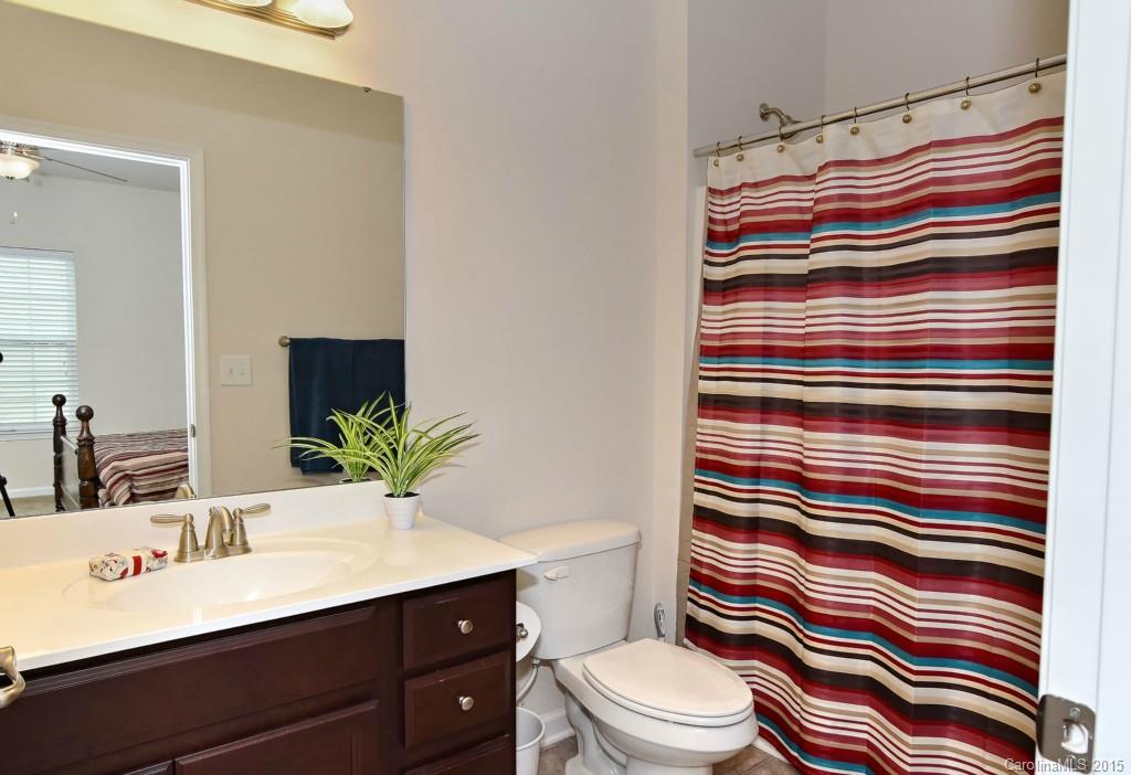 1621 Ridgehaven Road, Unit 240 Waxhaw, NC 28173 - Photo 21 of 24 a bathroom with a sink toilet and shower