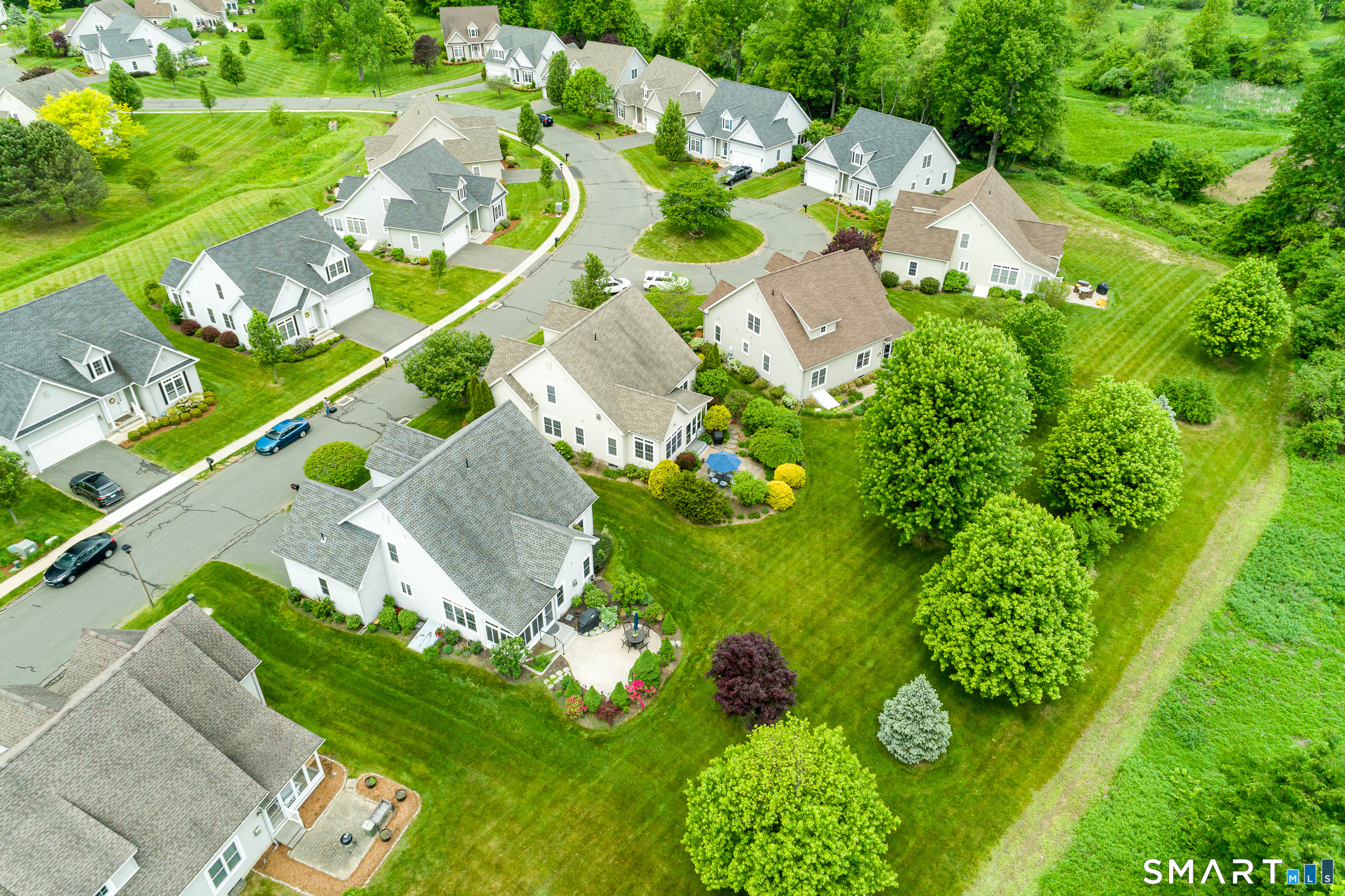 8 Greendale Drive, Unit 8 Suffield, CT 06078 - Photo 37 of 40 an aerial view of a residential houses with yard