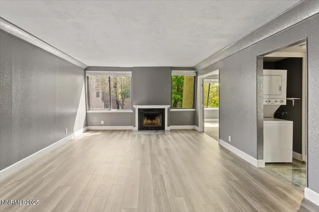 an empty room with furniture and a window