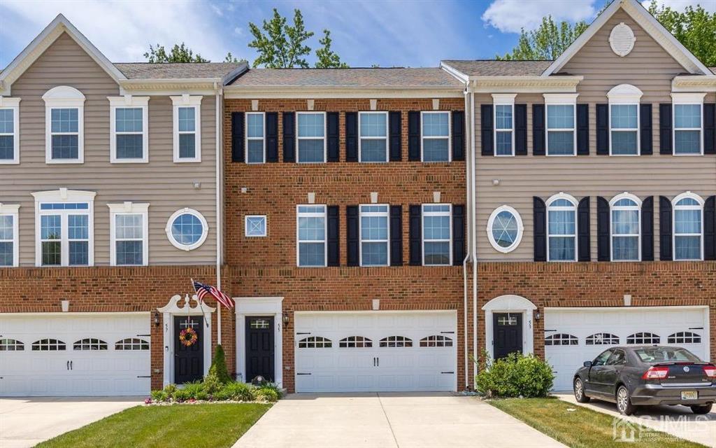 55 Isabelle Court Evesham, NJ 08053 - Photo 1 of 37 a front view of a building with garden