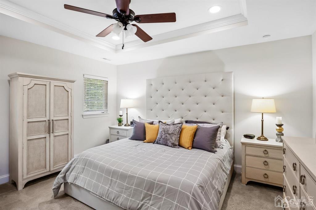 55 Isabelle Court Evesham, NJ 08053 - Photo 22 of 37 a bedroom with a bed and a chandelier