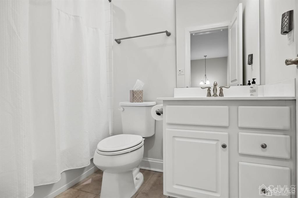 55 Isabelle Court Evesham, NJ 08053 - Photo 29 of 37 a bathroom with a sink a toilet and a mirror
