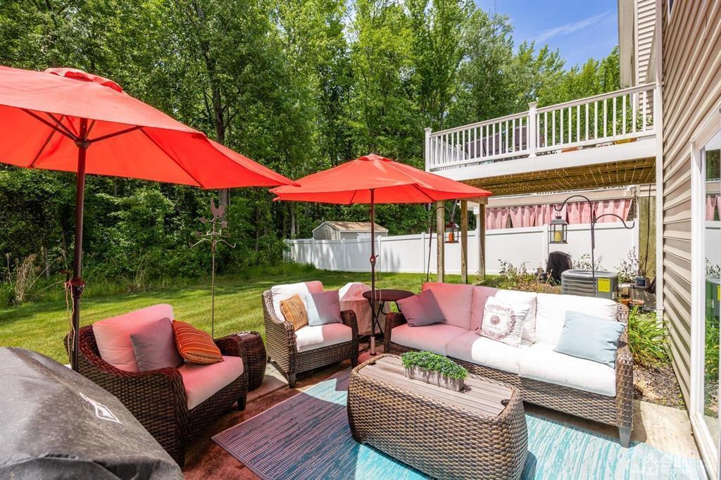 55 Isabelle Court Evesham, NJ 08053 - Photo 34 of 37 a view of a patio with couches under an umbrella