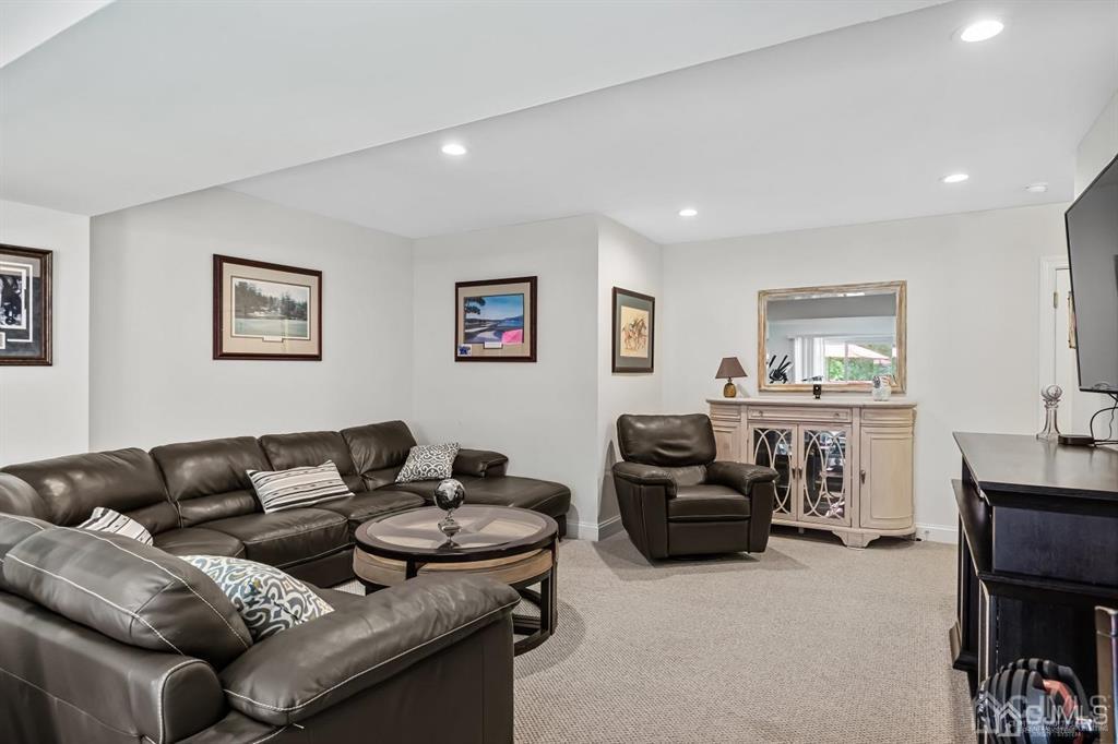 55 Isabelle Court Evesham, NJ 08053 - Photo 4 of 37 a living room with furniture and a flat screen tv