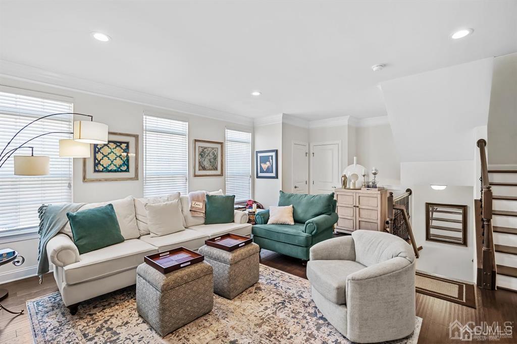 55 Isabelle Court Evesham, NJ 08053 - Photo 9 of 37 a living room with furniture a rug and a lamp