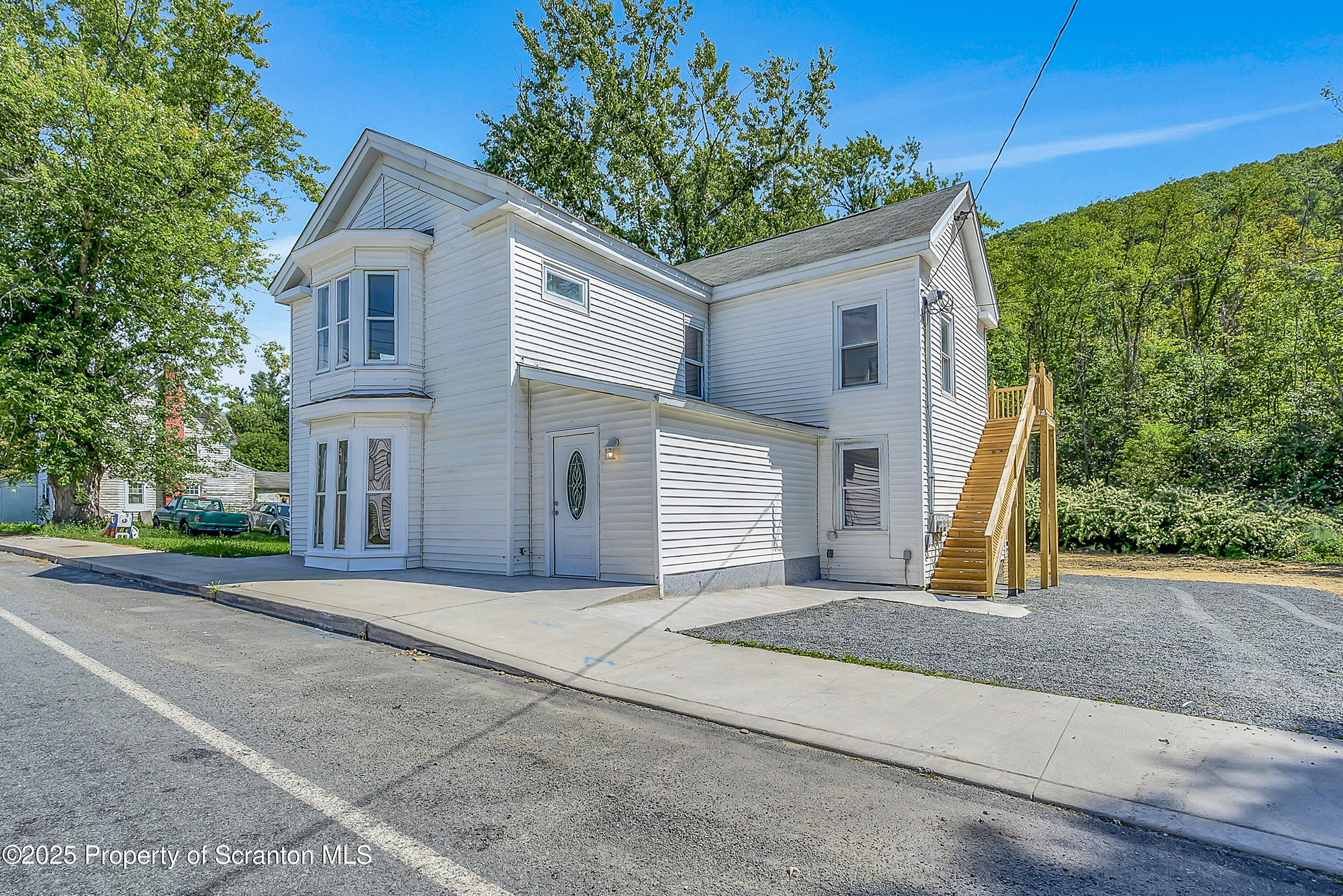 218 East Main Street Susquehanna, PA 18847 - Photo 1 of 43 a front view of a house with garage