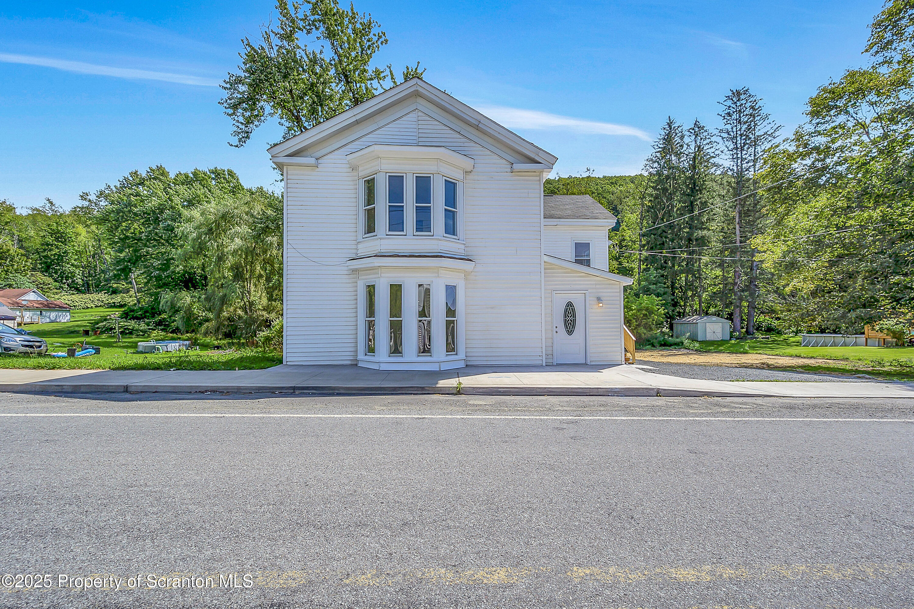218 East Main Street Susquehanna, PA 18847 - Photo 2 of 43 front view of a house with a yard