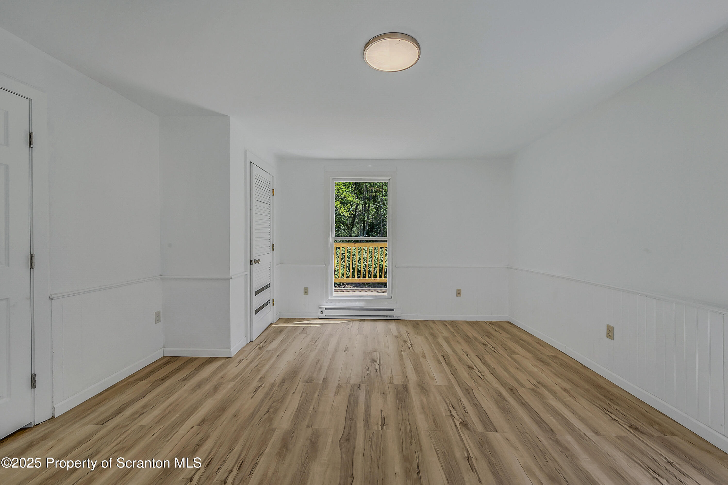 218 East Main Street Susquehanna, PA 18847 - Photo 30 of 43 a view of a room with wooden floor and window