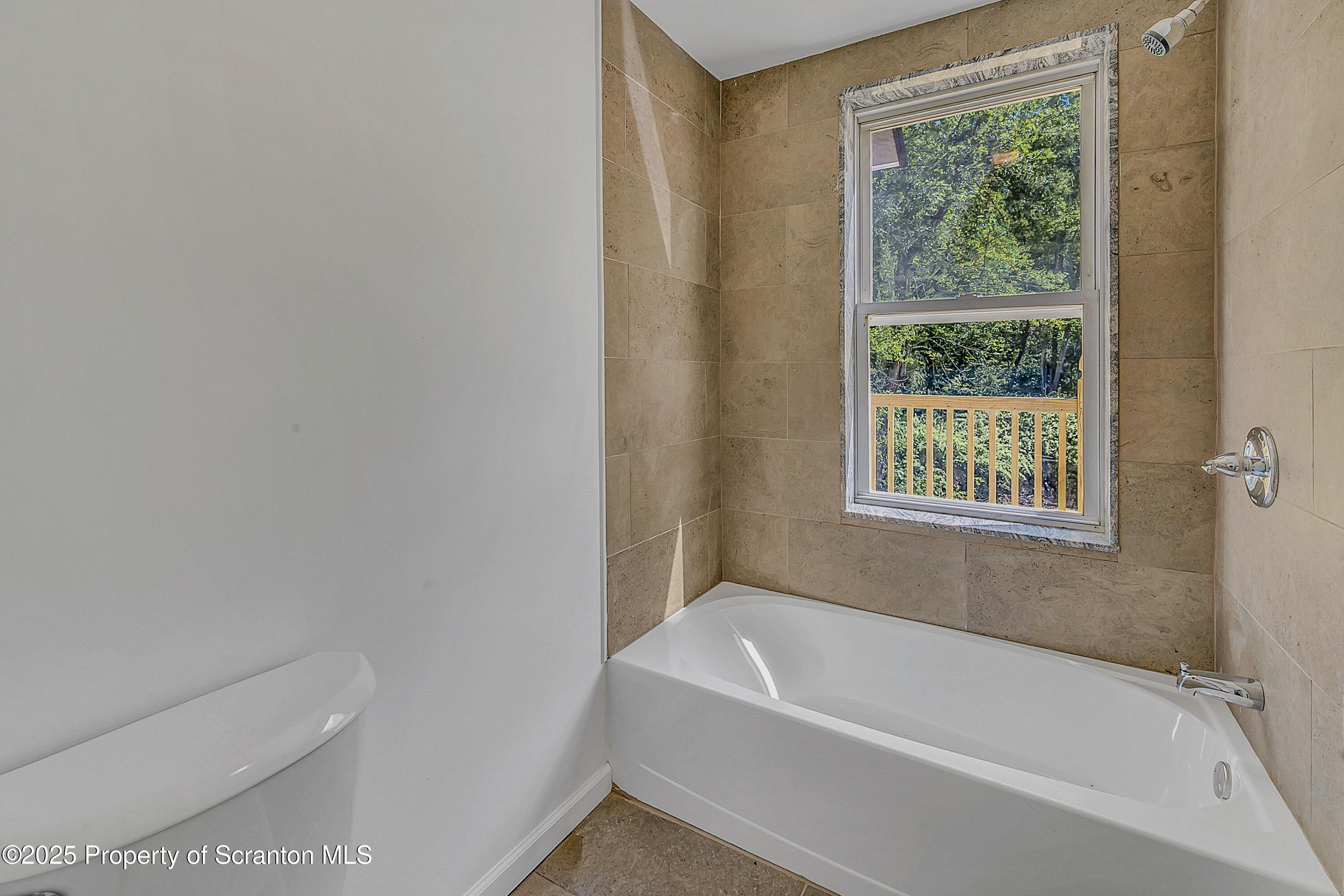 218 East Main Street Susquehanna, PA 18847 - Photo 32 of 43 a bathroom with a bathtub and window