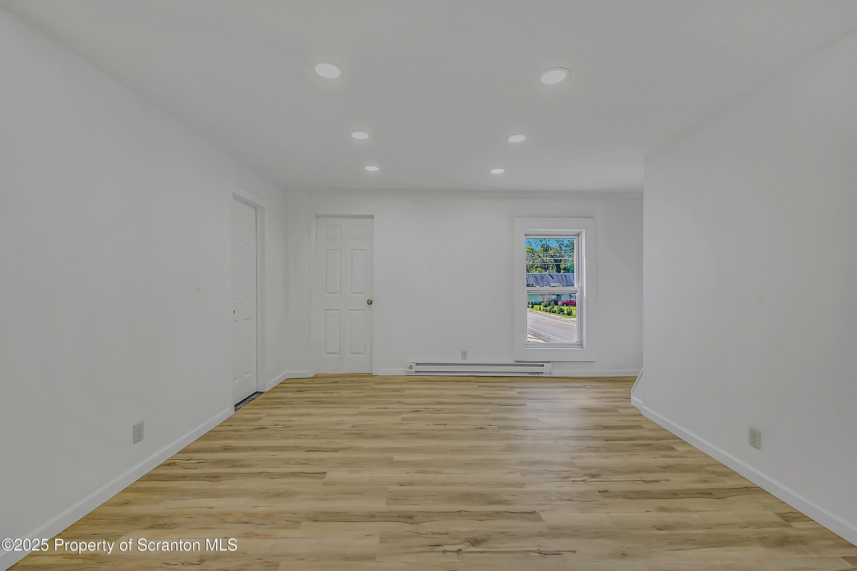 218 East Main Street Susquehanna, PA 18847 - Photo 33 of 43 a view of room with window and wooden floor