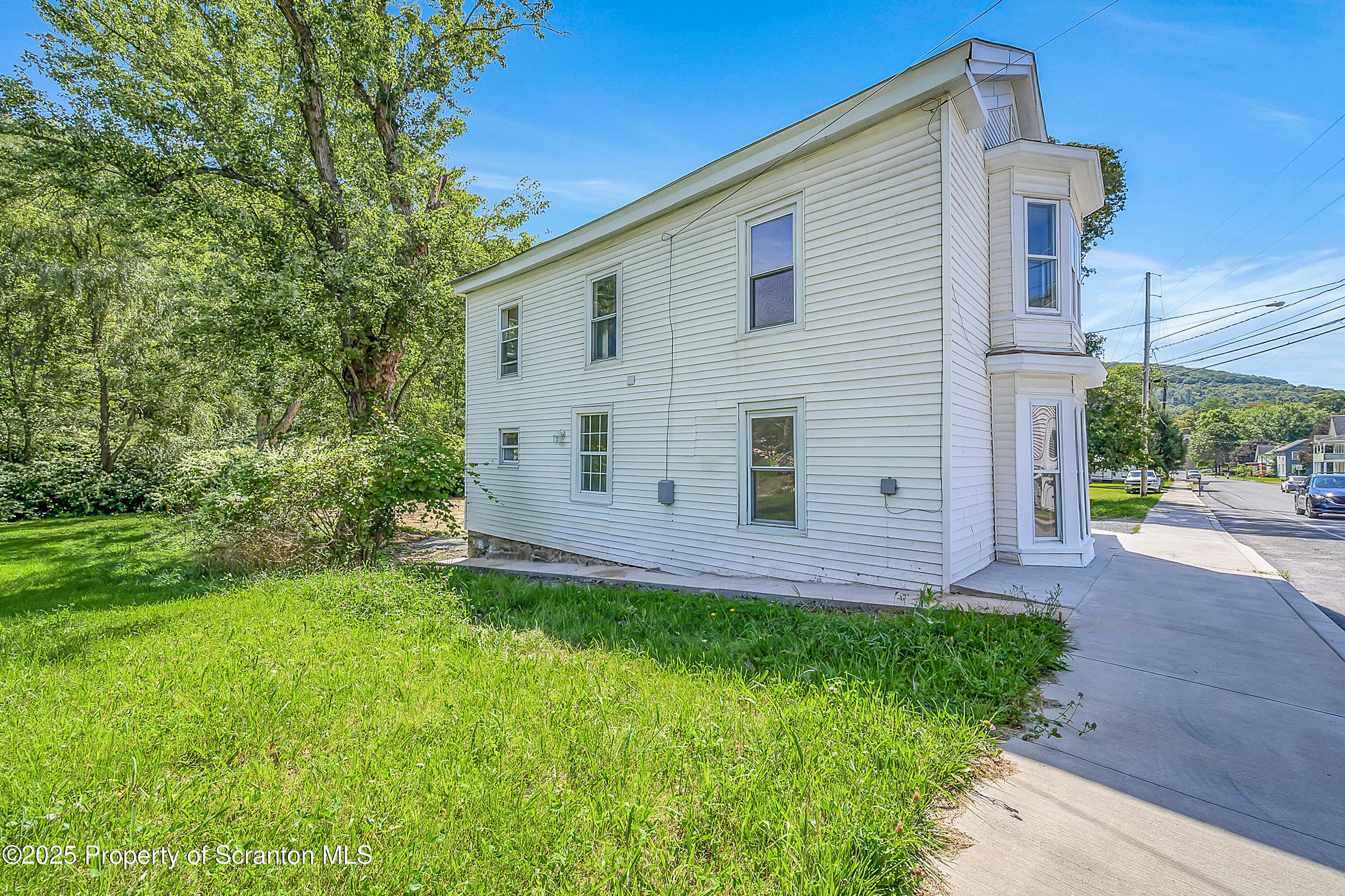 218 East Main Street Susquehanna, PA 18847 - Photo 40 of 43 a view of a house with a yard