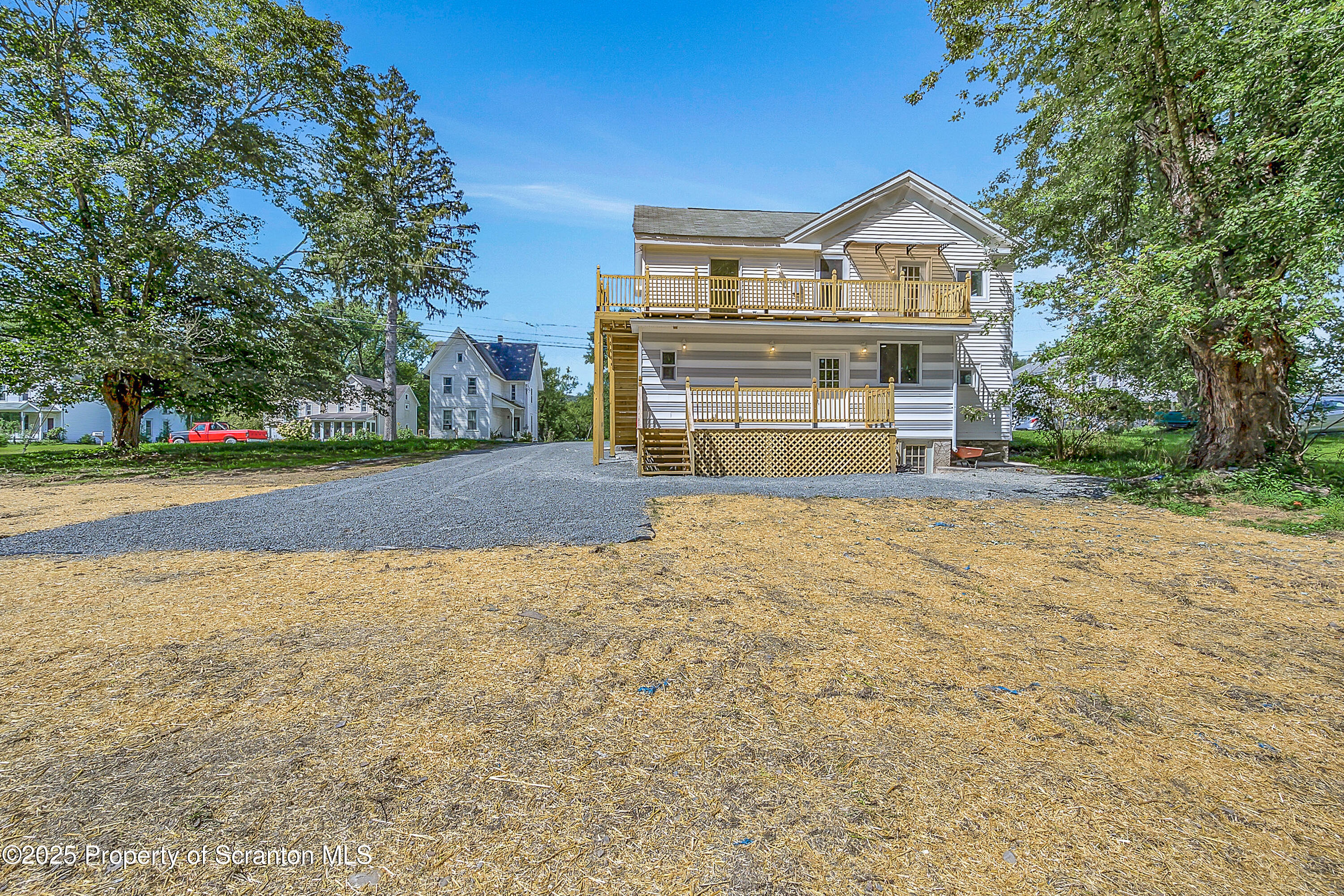 218 East Main Street Susquehanna, PA 18847 - Photo 42 of 43 a view of a house with a yard and garage