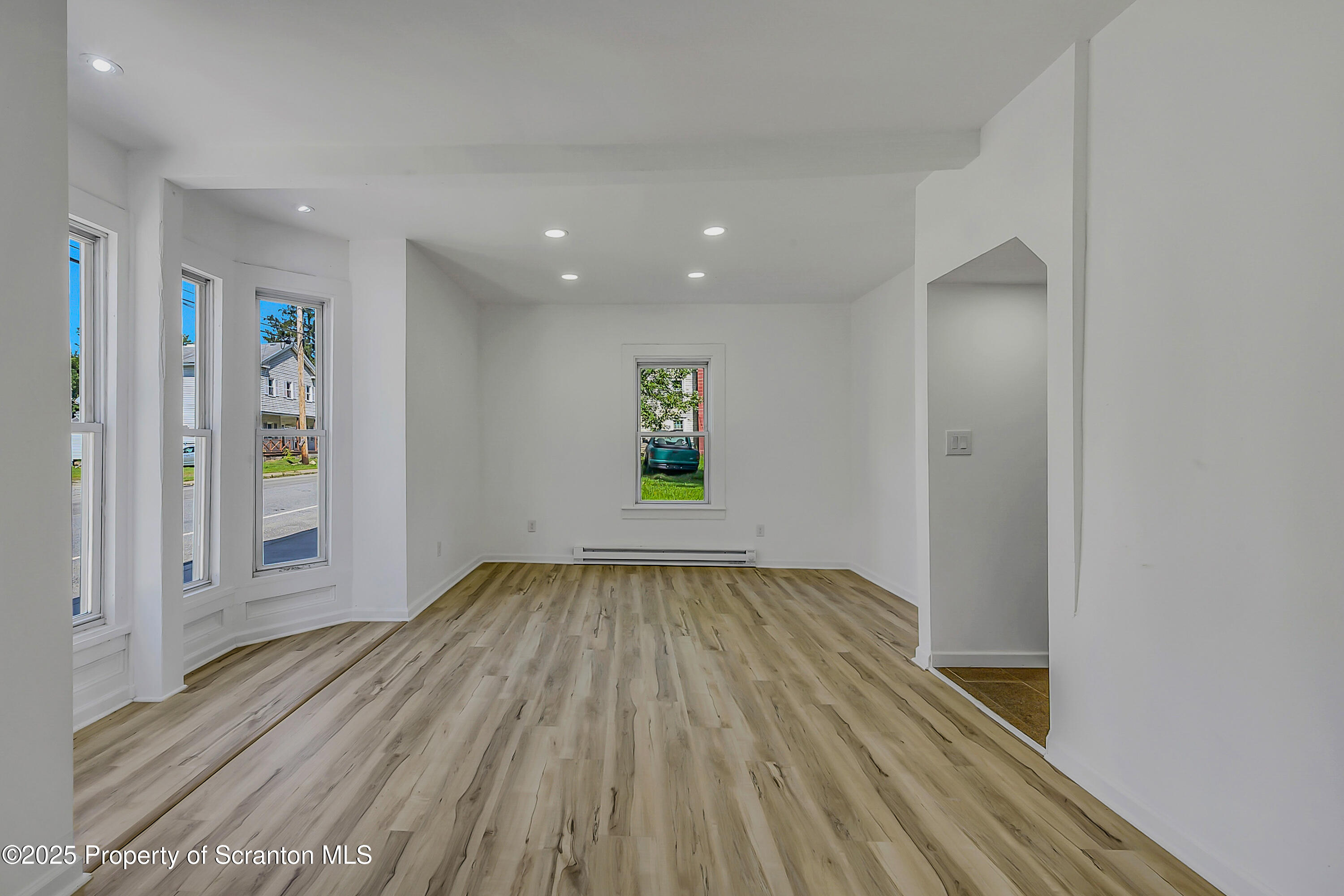 218 East Main Street Susquehanna, PA 18847 - Photo 7 of 43 wooden floor in an empty room with a window