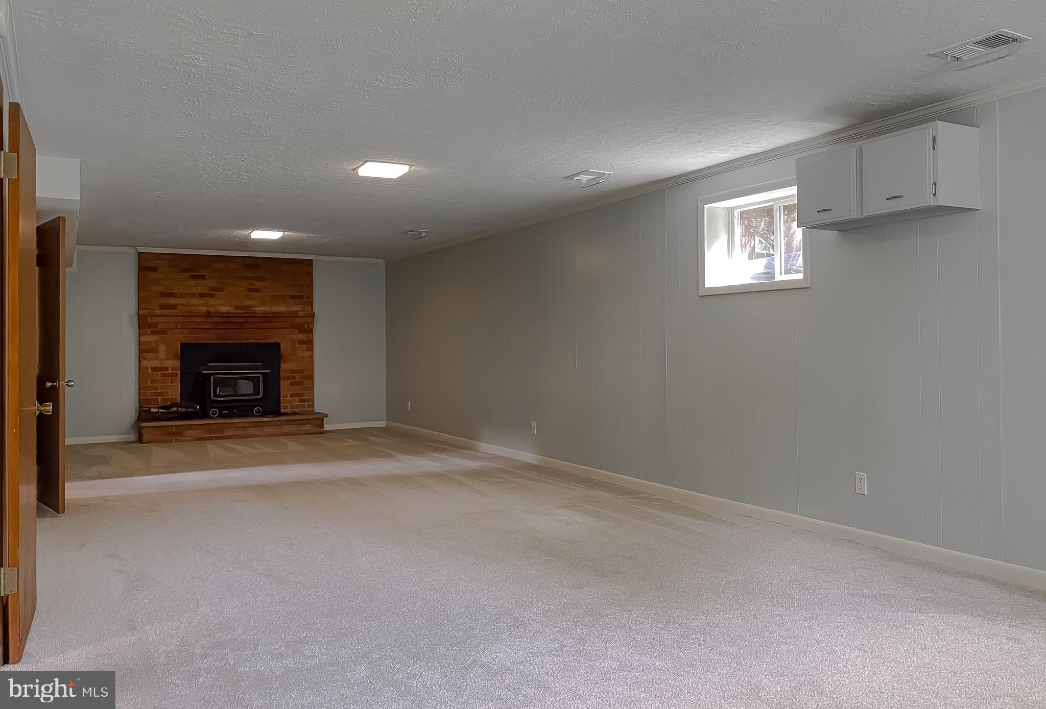 15805 Menk Road Accokeek, MD 20607 - Photo 36 of 56 FR in lower level w/fireplace & woodstove insert