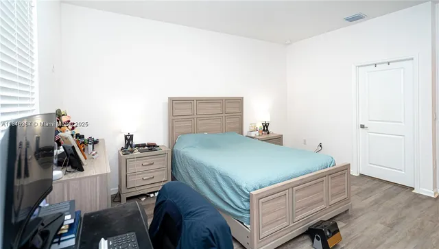 a bed room with a bed and furniture