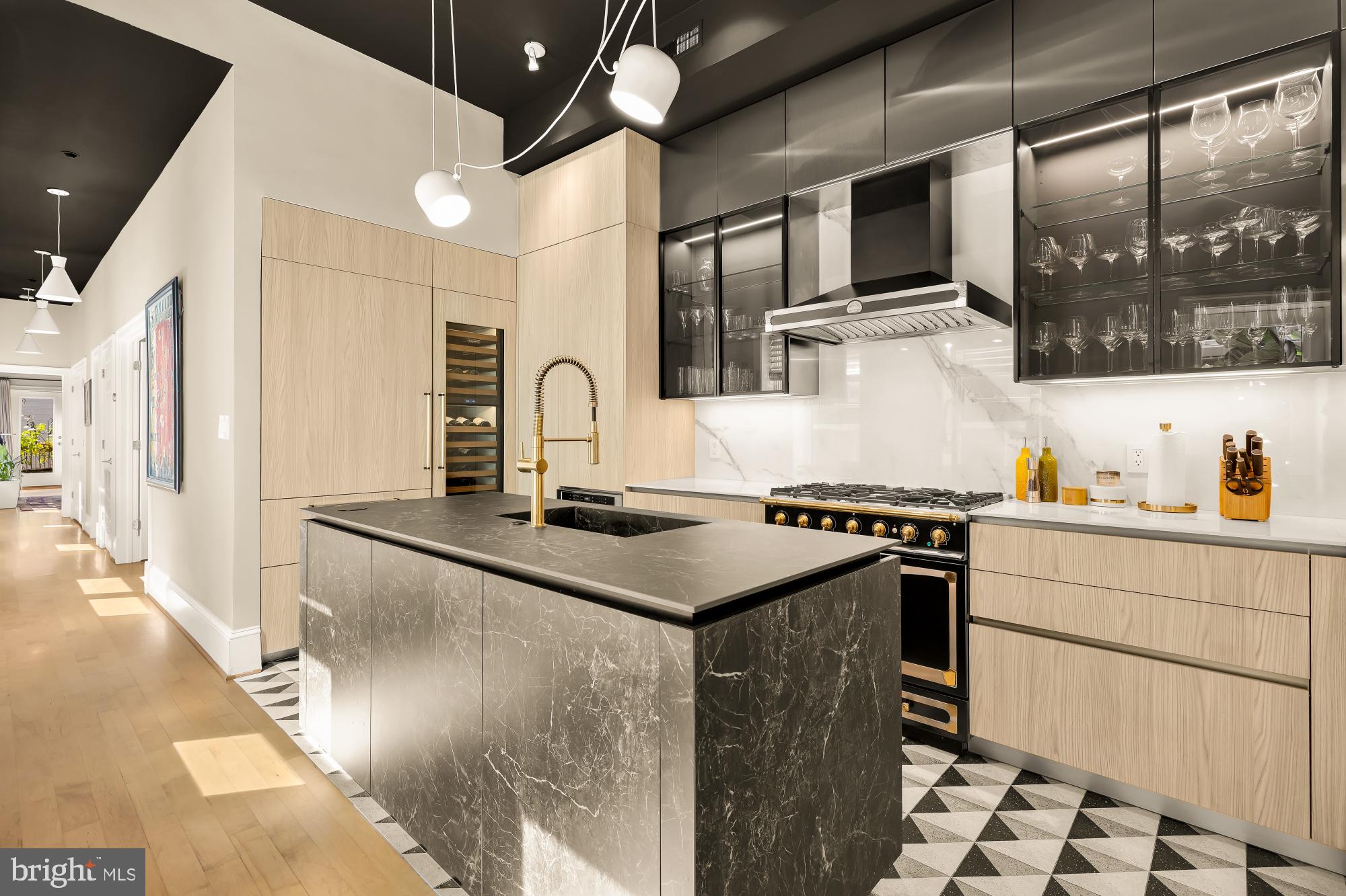 1220 N Street Northwest, Unit 4B Washington, DC 20005 - Photo 13 of 25 a kitchen with stainless steel appliances granite countertop a stove a sink and a refrigerator