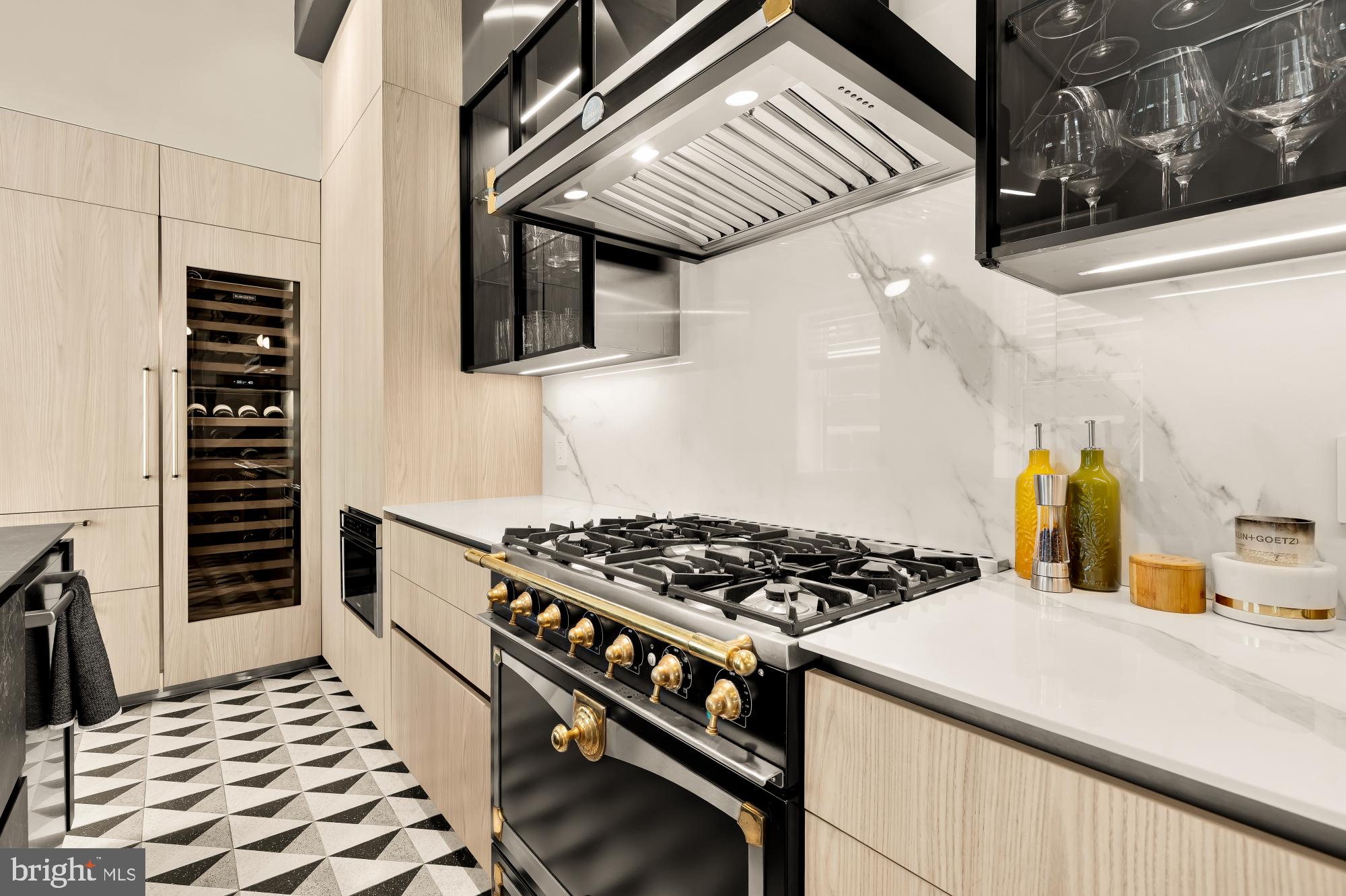 1220 N Street Northwest, Unit 4B Washington, DC 20005 - Photo 14 of 25 a kitchen with stainless steel appliances granite countertop a stove and a sink