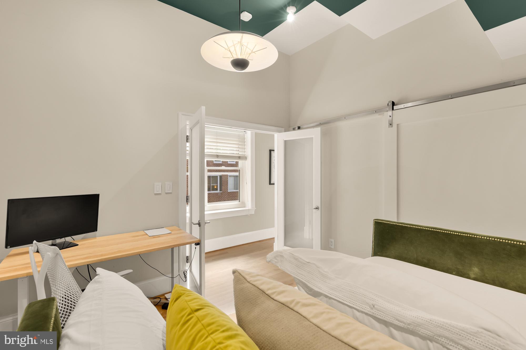 1220 N Street Northwest, Unit 4B Washington, DC 20005 - Photo 16 of 25 a bedroom with a bed and furniture