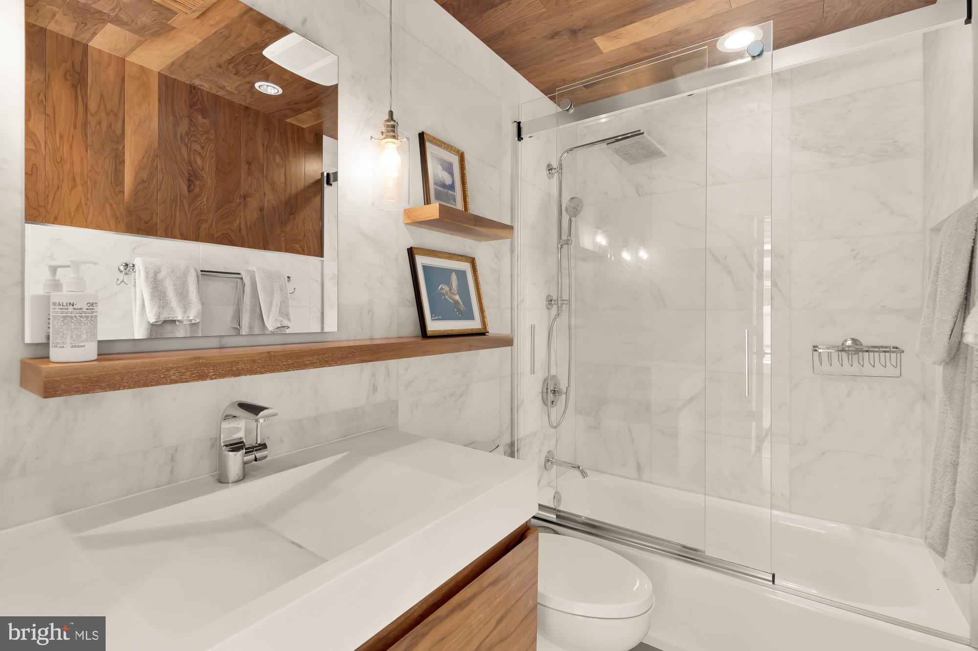 1220 N Street Northwest, Unit 4B Washington, DC 20005 - Photo 17 of 25 a bathroom with a sink a toilet and shower