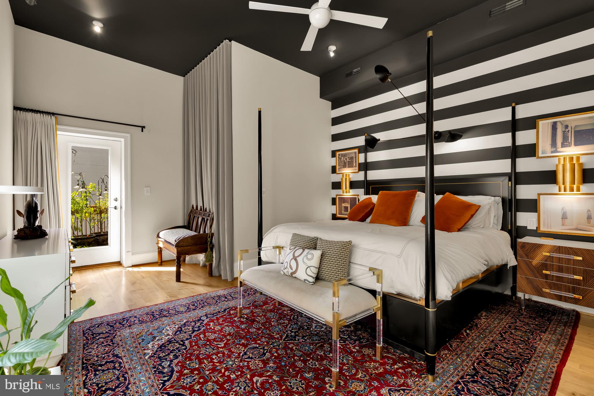 1220 N Street Northwest, Unit 4B Washington, DC 20005 - Photo 19 of 25 a bedroom with a bed and wooden floor