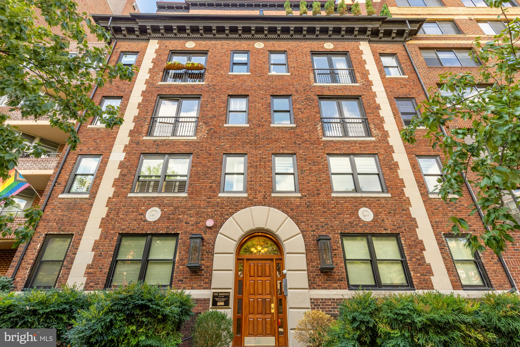 1220 N Street Northwest, Unit 4B Washington, DC 20005 - Photo 24 of 25 a view of a brick building next to a yard