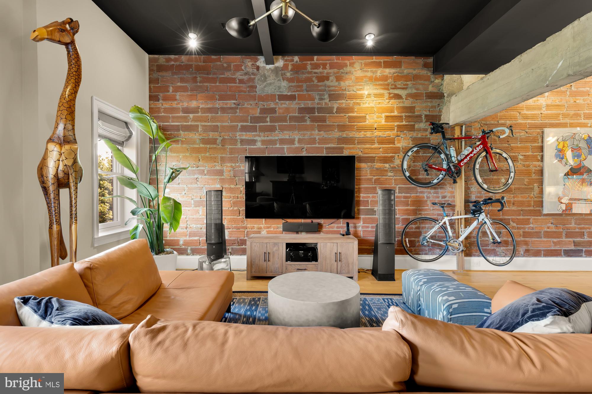 1220 N Street Northwest, Unit 4B Washington, DC 20005 - Photo 5 of 25 a living room with furniture and a fireplace