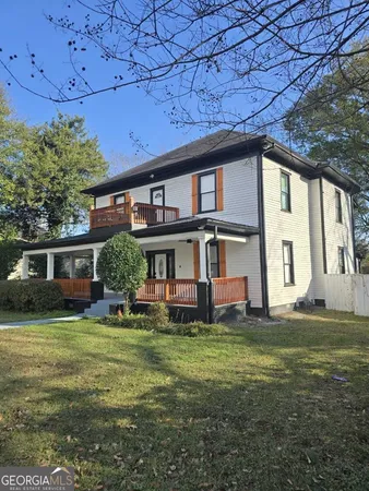 a view of a house with a big yard