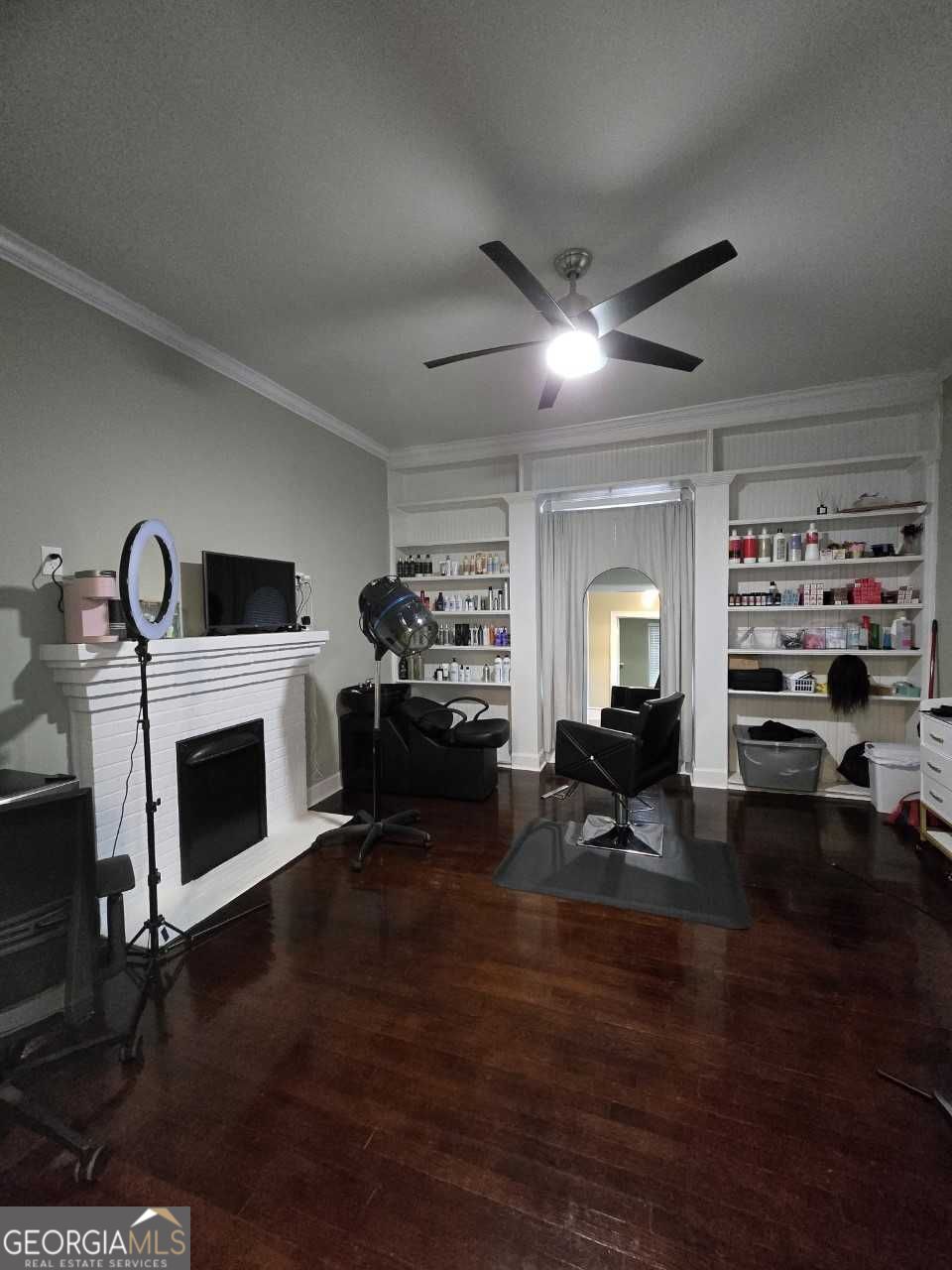402 Meriwether Street Griffin, GA 30224 - Photo 8 of 36 a living room with furniture a fireplace and a flat screen tv