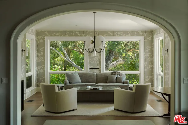 a bathroom with a granite countertop sink a mirror and bathtub