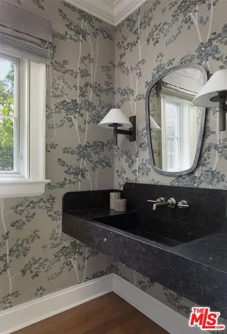 a bedroom with a bed and a mirror