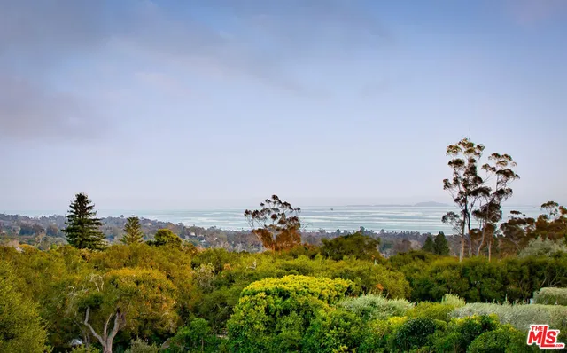 a dining table with chairs and window