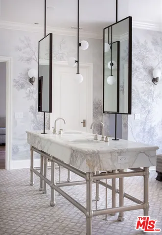 a living room with furniture a window and wooden floor