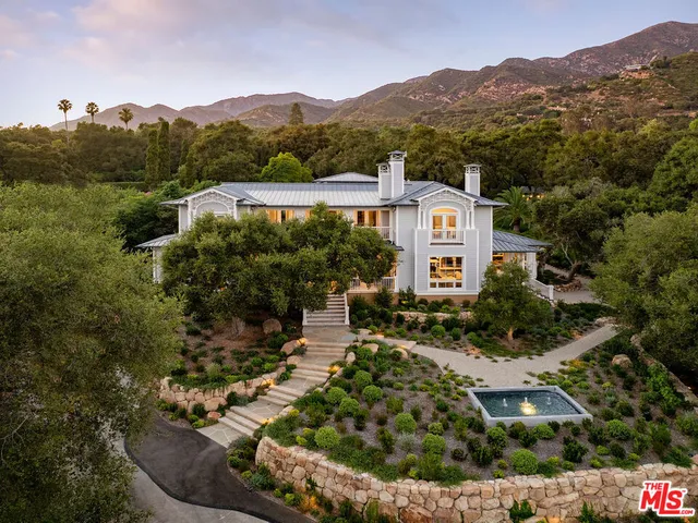 an aerial view of a house with a garden