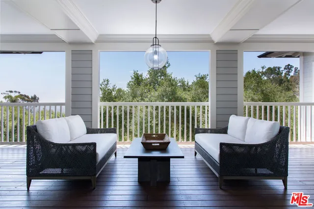 a bathroom with a granite countertop sink a mirror and a bathtub