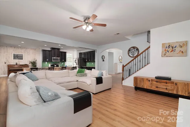 a large white bed in a white room