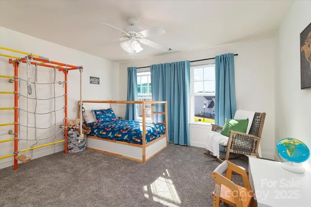 a bathroom with a sink vanity mirror and toilet