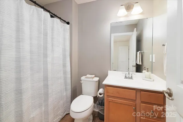 a living room with a couch and wooden floor